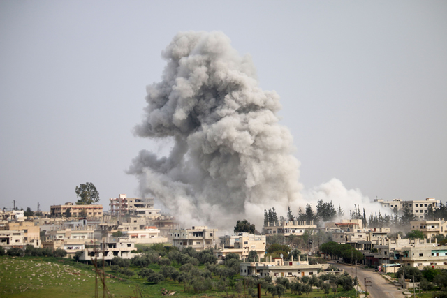 Smoke billows following a reported air strike on a rebel-held area in the southern Syrian city of Daraa, on Saturday (AFP photo)