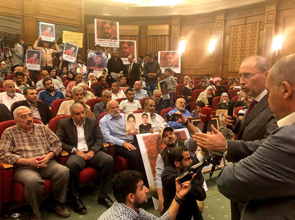 Foreign Minister Ayman Safadi meets with the families of Jordanian prisoners in Israel at the ministry’s headquarters on Monday (Petra photo)