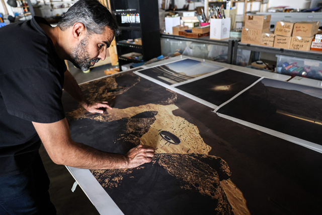 Saudi artist Ahmed Mater works at his studio in the capital Riyadh on June 19, 2022, on a project to be exhibited in the desert outside Al Ula, in the north-western Medina region  (AFP photo)