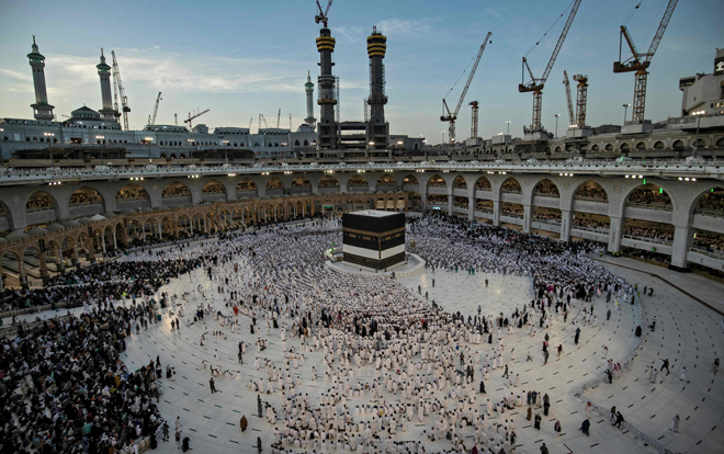 Muslim worshippers pray around the Kaaba at the Grand Mosque in Saudi Arabia’s holy city of Mecca, on Tuesday  (AFP photo)
