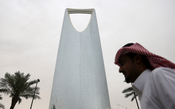 A man walks past the Kingdom Centre Tower in Riyadh, Saudi Arabia, on April 12 (Reuters photo)
