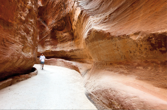 A tourist is seen in the Siq, a 1.2km-long gorge leading to the Treasury in Petra, some 220km southwest of Amman, which received some 800,000 visitors in 2018 (Photo courtesy of Jordan Tourism Board)