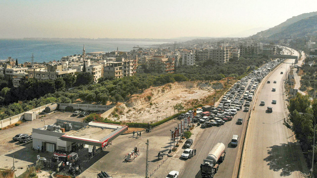 Lebanon's financial and political crisis has caused price hikes on basic goods and huge queues at petrol stations (AFP file photo)