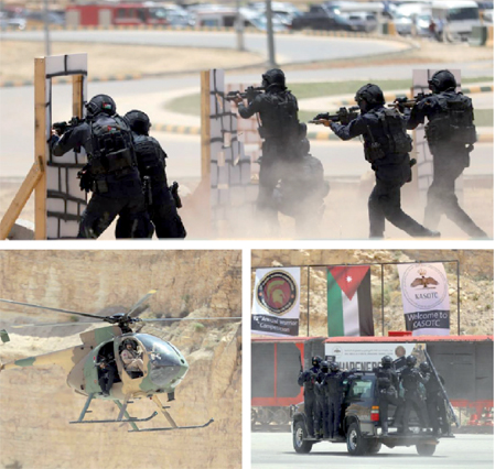 Teams participate in military drills during the 12th annual international Warrior Competition at the King Abdullah II Special Operations Training Centre on Sunday  (Photos by Osama Aqarbeh)