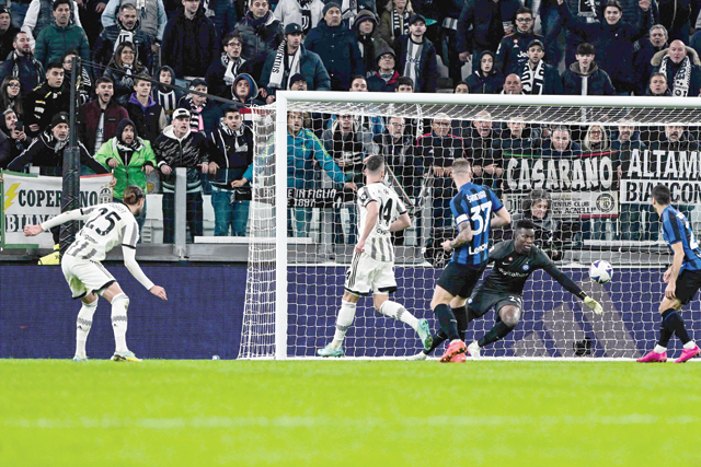 Juventus' French midfielder Adrien Rabiot (left) shoots to open the scoring during the Italian Serie A football match between Juventus and Inter on Sunday at the Juventus stadium in Turin (AFP photo)