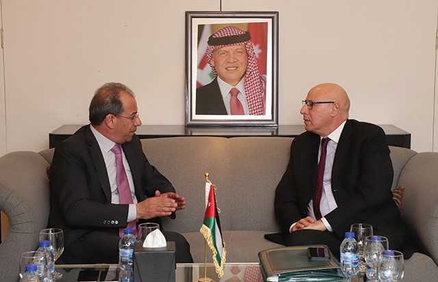 Minister of Government Communications Faisal Shboul meets with Arab League Deputy Secretary General and Head of the Media and Communication Sector Ahmed Rachid Khattabi in Amman on Saturday (Petra photo)