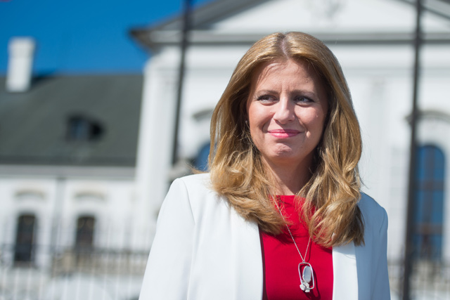 Newly elected Slovakia’s President Zuzana Caputova speaks to a journalist in the front of the presidential palace in Bratislava, Slovakia, on Sunday (AFP photo)