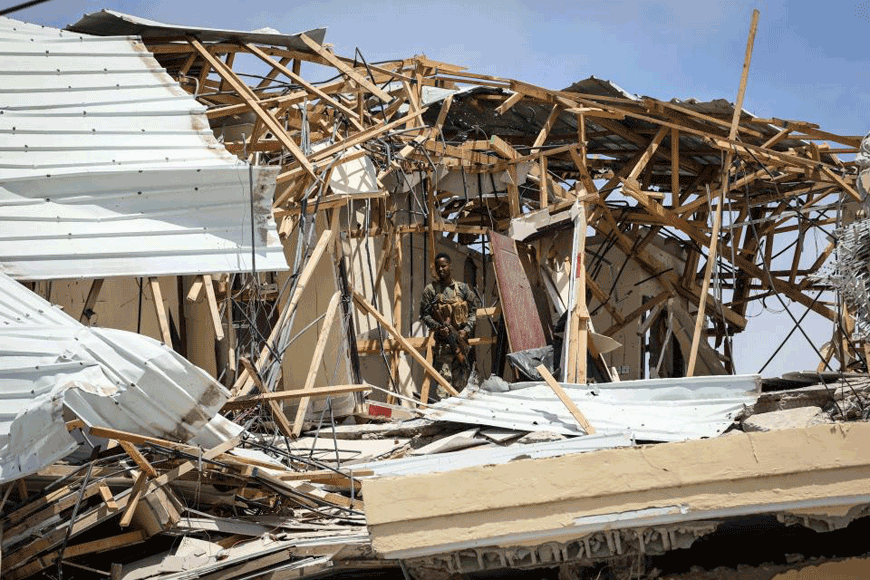 A security officer patrols on the roof of the destroyed Hayat Hotel after a deadly 30-hour siege by Al Shabaab terrorists in Mogadishu in August (AFP photo)