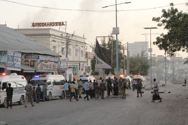 Ambulances wait near the site where a bomb blasted in Mogadishu, Somalia, on Sunday (AFP photo)