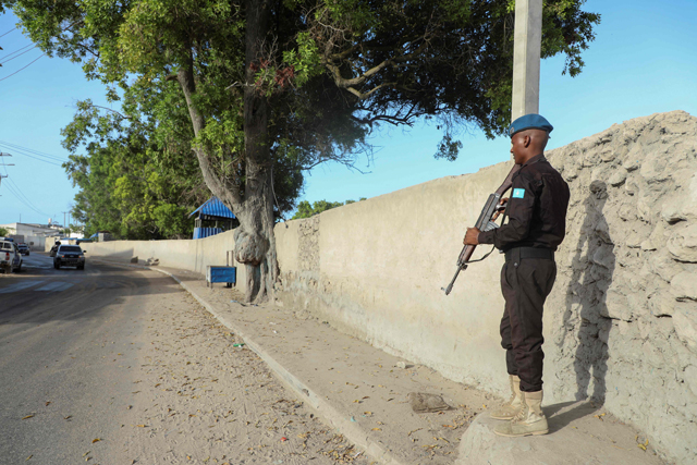 A Somali security officer enforces a security cordon mounted by Africa Union forces to lockdown the entire city due to the presidential election in Somalia capital, Mogadishu, on Sunday   (AFP photo)