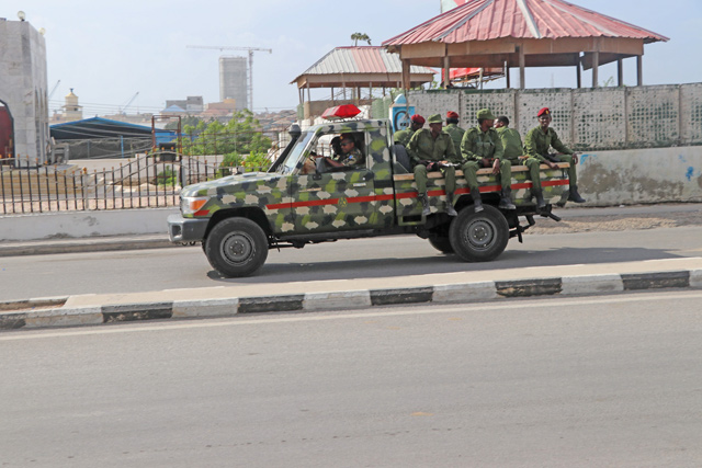 Somali government soldiers on a military vehicle are seen outside the SYL Hotel in Mogadishu on Wednesday (AFP photo)
