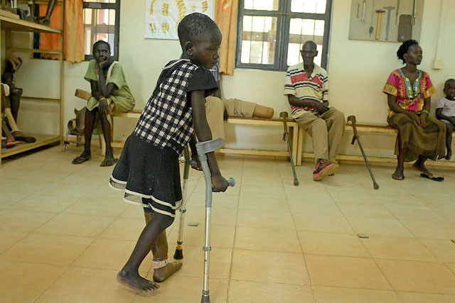 Laytol, five, walks with the use of a new prosthetic limb at the physical rehabilitation centre run by the International Committee of the Red Cross, in Juba, on March 12 (AFP photo)