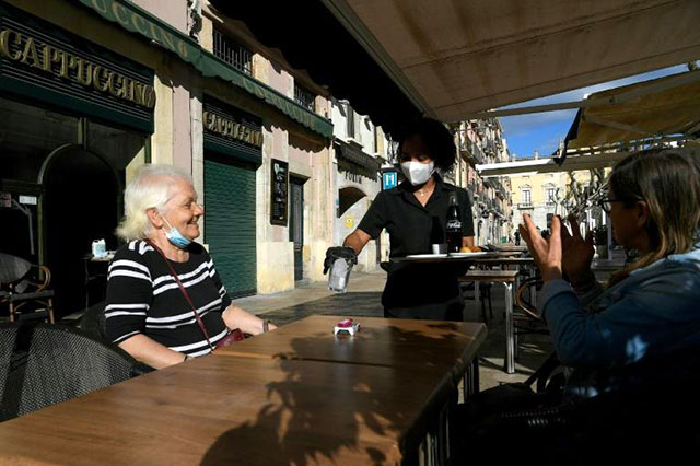 Around half of Spain's population of 47 million live in regions where the lockdown restrictions were eased on Monday (AFP photo)