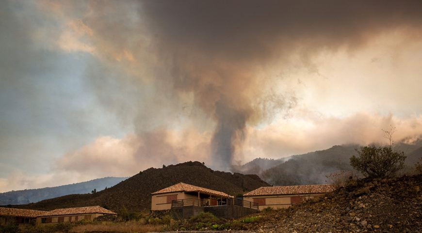 Smoke rises from cooling lava in the residential area of Los Campitos at Los Llanos de Aridane, on the Canary Island of La Palma, on Monday (AFP photo)