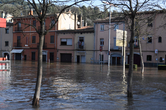 A flooded street is photographed in Sarria de Ter on Thursday, as storm Gloria batters Spanish eastern coast (AFP photo)