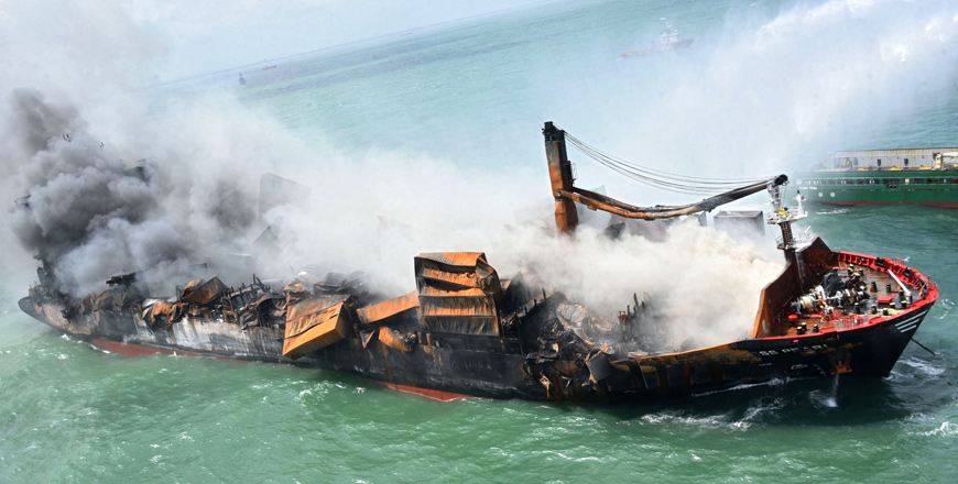 This handout photograph taken and released by the Sri Lanka Air Force on Saturday shows smoke billowing from the Singapore-registered container ship MV X-Press Pearl, which has been burning for the tenth consecutive day in the sea off Sri Lanka's Colombo Harbour (AFP photo)
