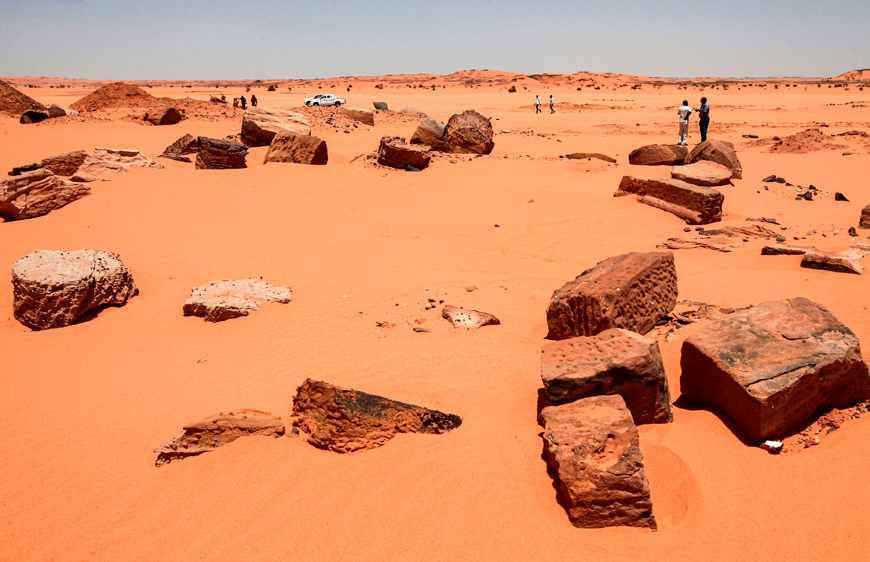Remains of the two millenia-old site of Jabel Maragha that was ravaged by gold hunters are scattered on the sand in the desert of Bayouda, some 270 km north of the Sudanese capital Khartoum, on Thursday (AFP photo)
