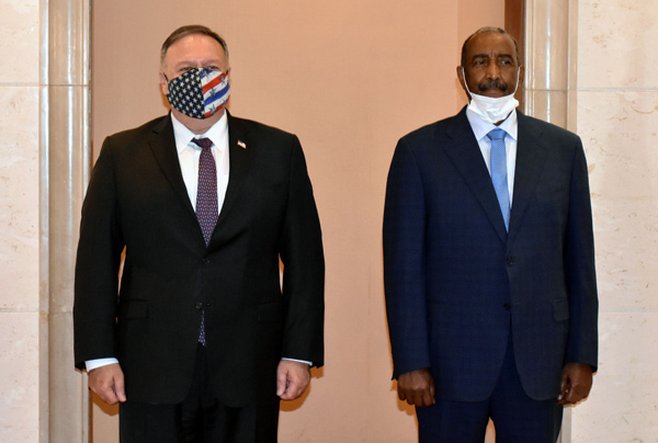 In this file photo taken on August 25, US Secretary of State Mike Pompeo (left) poses for a photo with Sudan's Sovereign Council chief General Abdel Fattah Al Burhan in Khartoum (AFP photo)