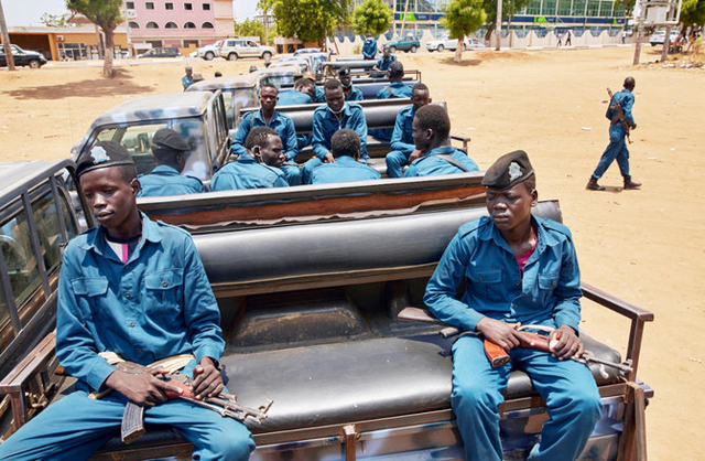 South Sudan National Police Service officers sit in a pickup truck while they gather ahead of patrolling the streets of Juba, South Sudan, that is witnessing a ‘new wave of repression’, global rights group Amnesty International warned, on Friday  (AFP photo)