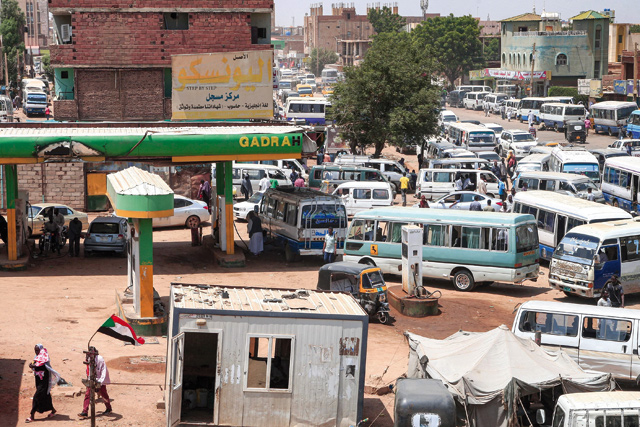 Vehicles queue at a petrol station near the ‘Local Market’ in the south of Sudan’s capital Khartoum, on Wednesday (AFP photo)