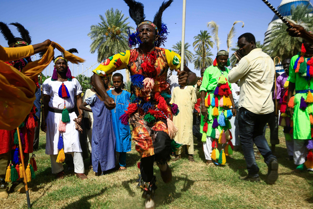 Tribal dancers perform as delegations arrive to attend a conference entitled the ‘National Consensus Charter of the Forces of Freedom and Change’ in Sudan’s capital Khartoum, announcing the formation of an alliance separate from the country’s main civilian bloc, on Saturday  (AFP photo)