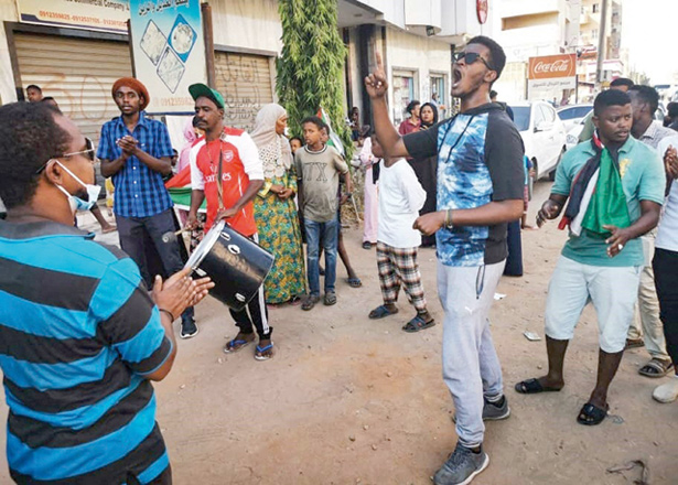 Sudanese youths chant slogans as they protest in the streets of the capital Khartoum, amid ongoing demonstrations against a military takeover that has sparked widespread international condemnation, on Thursday (AFP photo)