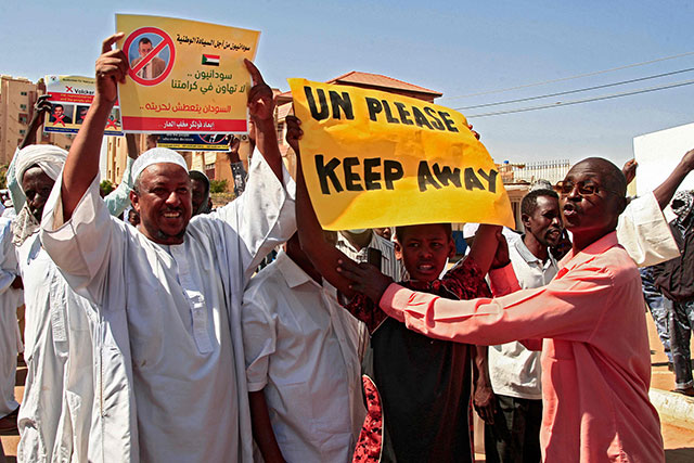 Sudanese pro-military protesters chant slogans as they demonstrate against a UN bid to resolve a political crisis outside the Khartoum office of the UN Transition Assistance Mission Sudan in the Sudanese capital on Wednesday (AFP photo)