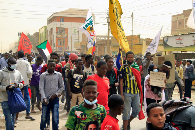 Demonstrators march during ongoing protests calling for civilian rule and denouncing the military administration, in the Sahafa neighbourhood in the south of Sudan’s capital Khartoum, on Sunday  (AFP photo)