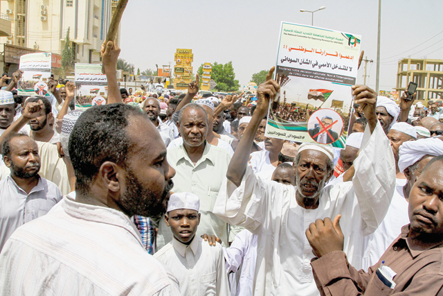 People gather for a protest outside the UN mission in Sudan's capital Khartoum on Wednesday (AFP photo)