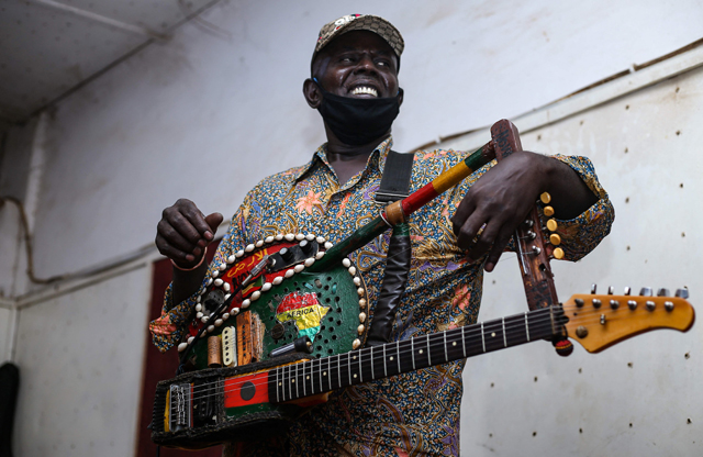 Noureddine Jaber plays a song during rehearsals at a studio in Omdurman, the capital Khartoum’s twin city, on May 18  (AFP photo)