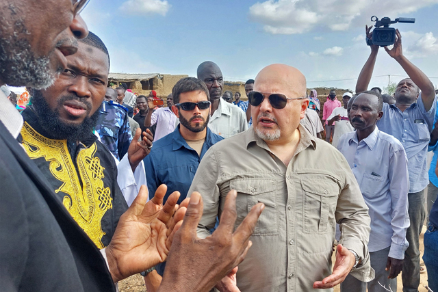 International Criminal Court's Chief Prosecutor Karim Khan (centre) visits the Kalma camp for internally displaced people in Nyala, the capital of South Darfur, on Sunday (AFP photo)