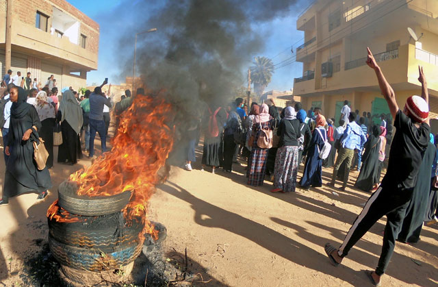 Sudanese demonstrators burn tyres as they participate in anti-government protests in Omdurman, Khartoum, Sudan, on Sunday (Reuters photo)