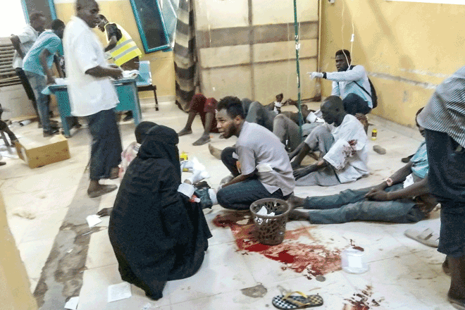 In this photo taken on June 20, wounded people receive treatment at Al Bashayer hospital in northern Khartoum (AFP photo)