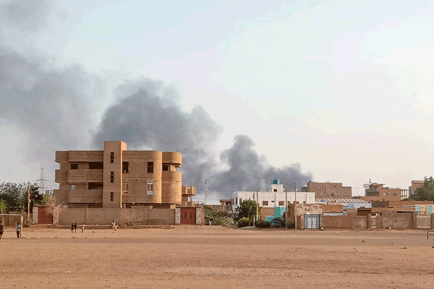 Smoke billows in the distance around the Khartoum Bahri district amid ongoing fighting on Friday (AFP photo)