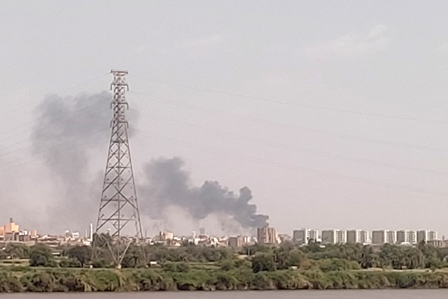 A photo taken from Omdurman shows smoke billowing north of Khartoum, on Saturday (AFP photo)