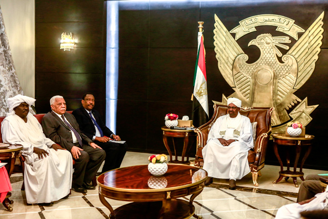 Sudanese President Omar Al Bashir (right) chairs a meeting of leaders of some political parties, in the capital Khartoum, on Thursday (AFP photo)