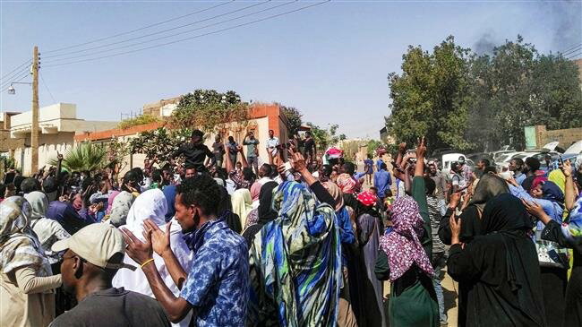 This file photo shows Sudanese protesters chanting slogans during an anti-government demonstration in Omdurman city on March 10 (AFP photo)