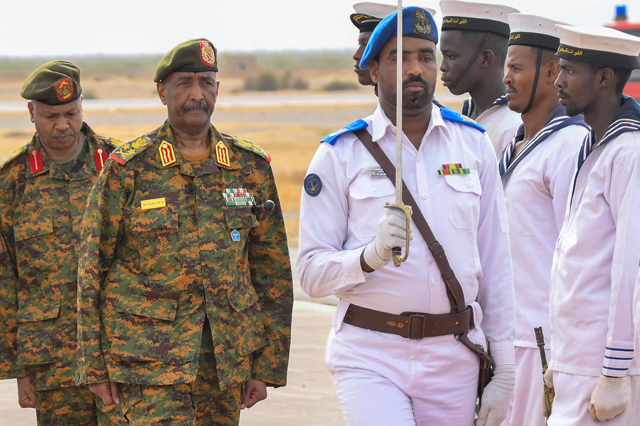 Sudan’s army chief Abdel Fattah Al Burhan (left) arrives to the coastal city of Port Sudan, on Sunday (AFP photo)