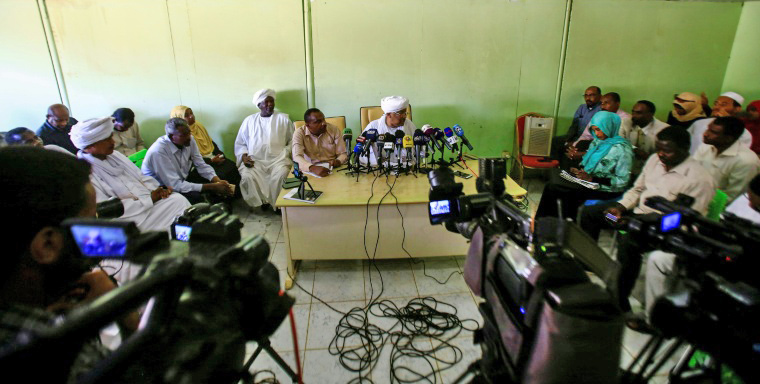 Journalists gather at a press conference by Idris Suleman, a senior official from the Popular Congress Party, in Khartoum, Sudan,  on Wednesday (AFP photo)