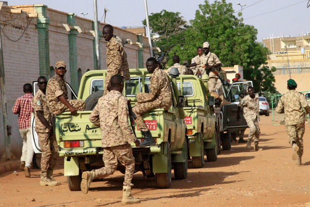 This photo taken on Sunday shows vehicles in the convoy transporting Sudan’s ousted president as he is taken from Kober prison to the anti-corruption prosecution’s offices in the capital Khartoum to face charges of corruption and illegal possession of foreign currency (AFP photo)
