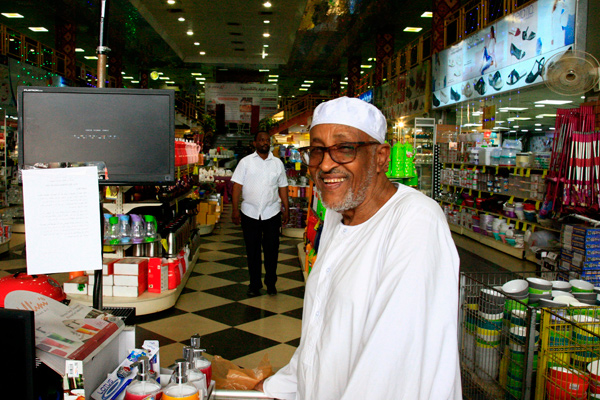 Haj Abul Fadel, a Sudanese millionaire businessman, is photographed at his shopping centre in Khartoum, on Wednesday (AFP photo)