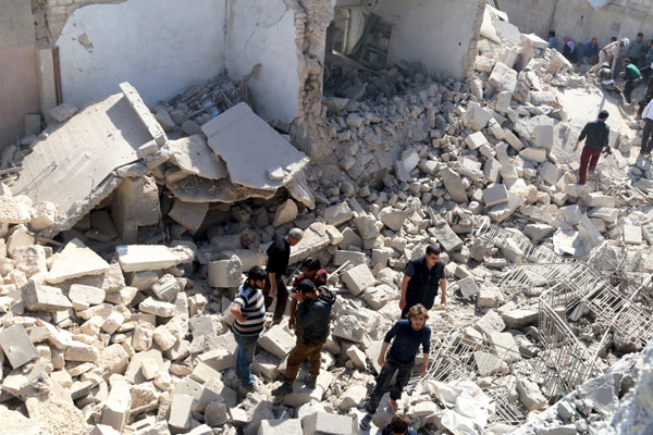 Residents look for survivors amidst the rubble after an air strike on the rebel-held Old Aleppo, Syria, on Saturday (Reuters photo)