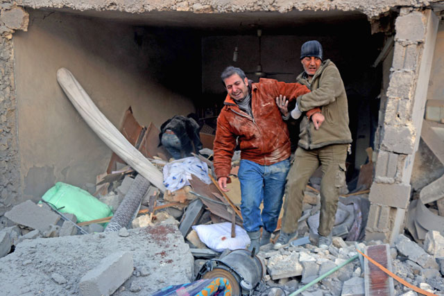 A man reacts following reported air strikes on Aleppo’s rebel-held district of Al Hamra on Sunday (AFP photo)