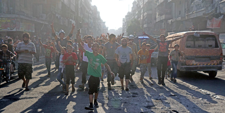 Syrians gather in a street in the northern city of Aleppo on Saturday, in celebrations after rebels said they have broken a three-week government siege (AFP photo by Thaer Mohammed)