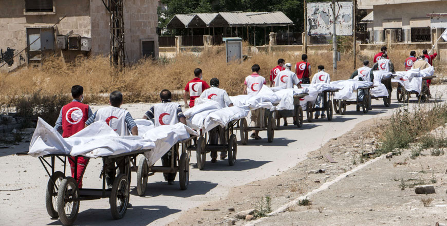 Members of the Syrian Red Crescent transport the bodies of reported regime fighters from rebel-held area into a regime-held area in Aleppo on Thursday during a reported exchange operation between the two sides (AFP photo)