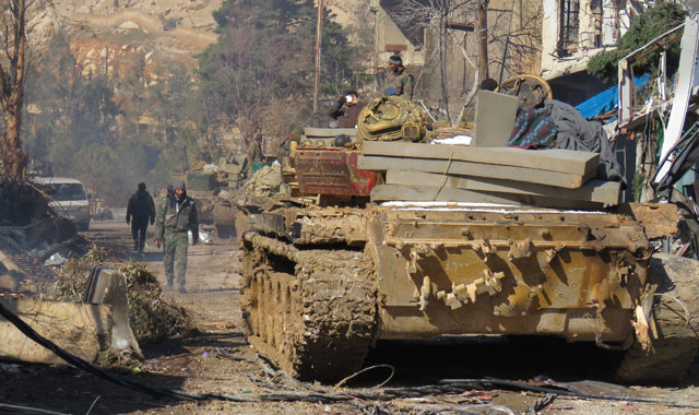 Pro-Syrian regime fighters patrol around the area of Ain Al Fijeh water pumping station in the countryside of Damascus, on Sunday, for the first time in four years after a deal with rebels who first seized it in 2012 (AFP photo)