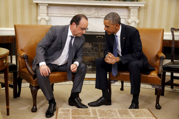 US President Barack Obama talks with President Francois Hollande during a meeting in the Oval Office of the White House in Washington, Tuesday (Reuters photo)