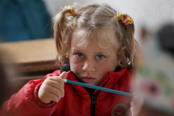 A student attends a class inside the Freedom School, in the town of Al Tamanah, in the southern countryside of Idlib, Syria, on Wednesday (Reuters photo)