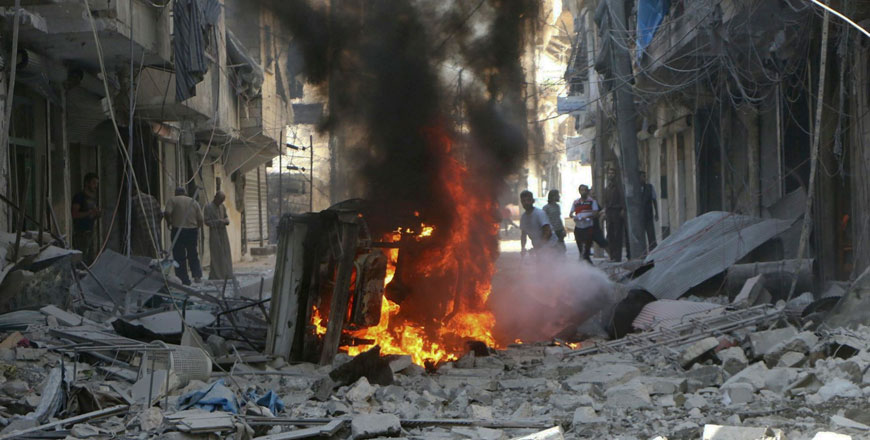 In this photo provided by the Syrian Civil Defence group known as the White Helmets, Syrians inspect damaged buildings after air strikes by government helicopters on the rebel-held Aleppo neighbourhood of Mashhad, Syria, Tuesday (AP photo)