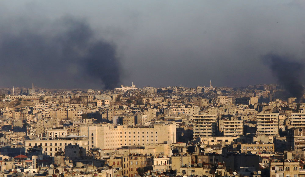A general view taken from the government-held side of Aleppo shows smoke billowing during fighting between Syrian regime forces and rebel fighters in east Aleppo, on Saturday (AFP photo)